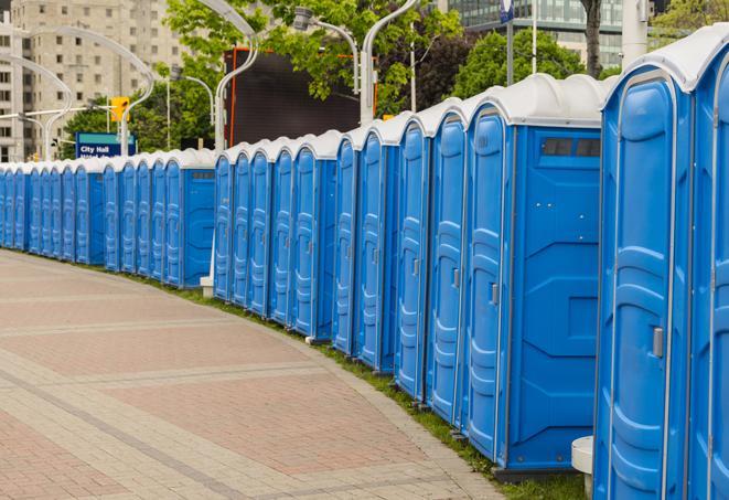 a row of portable restrooms at an outdoor special event, ready for use in Ashland, VA